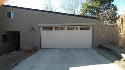 Beige Contemporary Style Flush Garage door with windows at the top