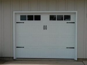 Small White Carriage Style garage door with decorative windows
