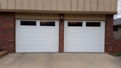 Two Small garage doors with windows at the top