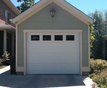 Small White Insulated Steel, traditional style garage door with decorative windows